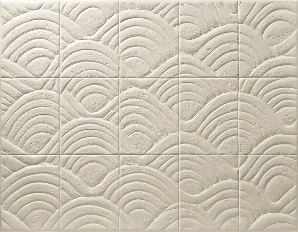 a wave-like pattern on a cream tile