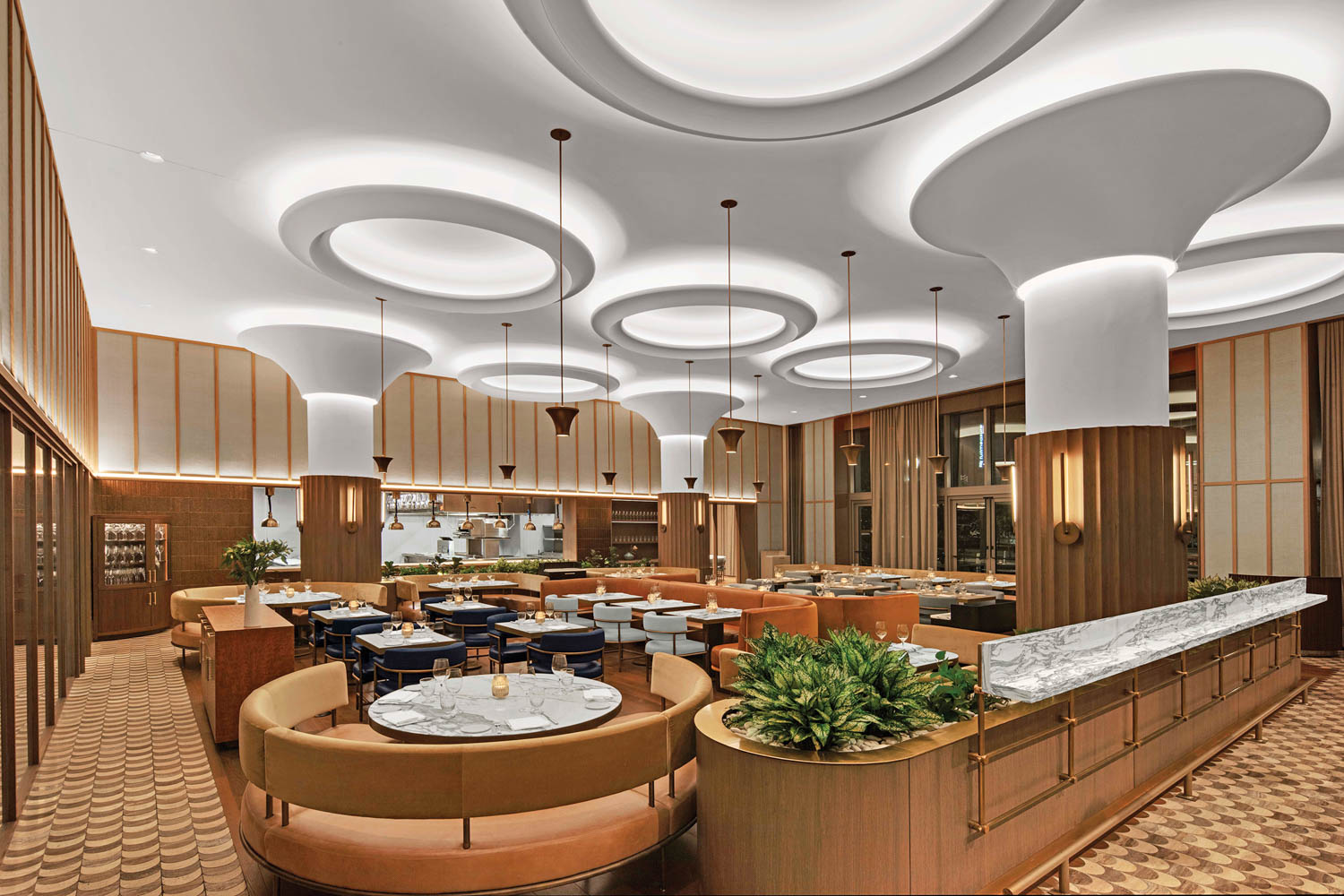 a circular leather booth inside a hotel dining room