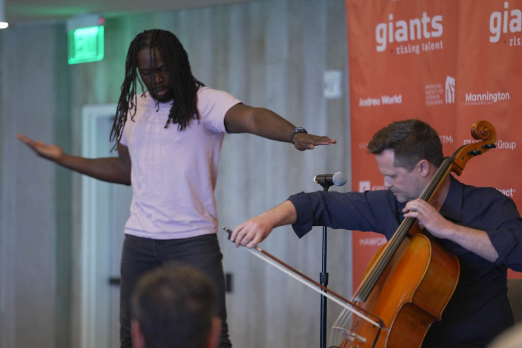 a cellist and dancer perform a piece about happiness