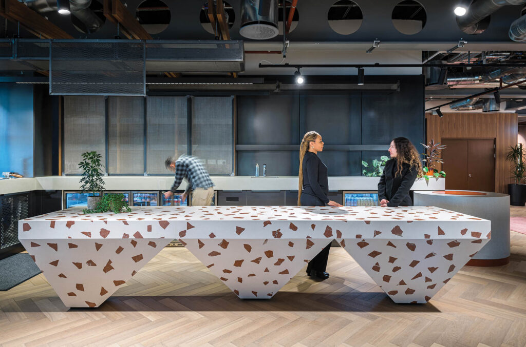 Combining functionality and wit, a custom terrazzo hospitality counter in a reception area