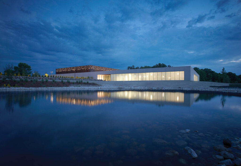 Exterior of The Kohler Communications Center at dusk