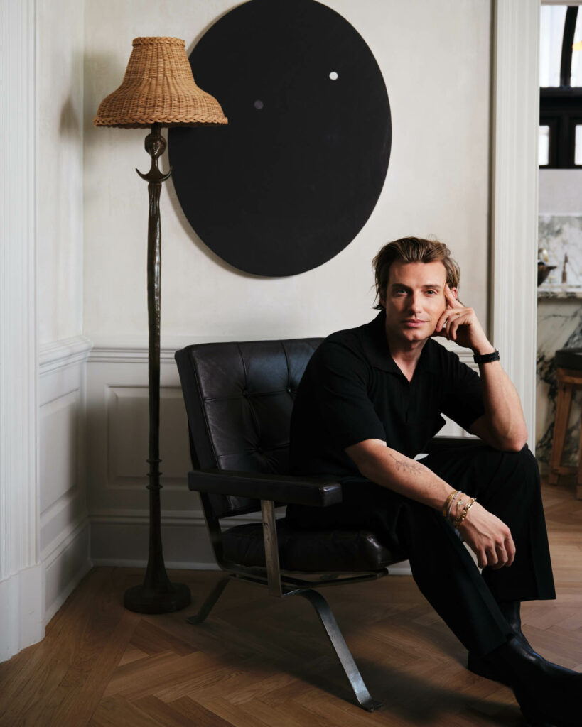 Jeremiah Brent on a black chair