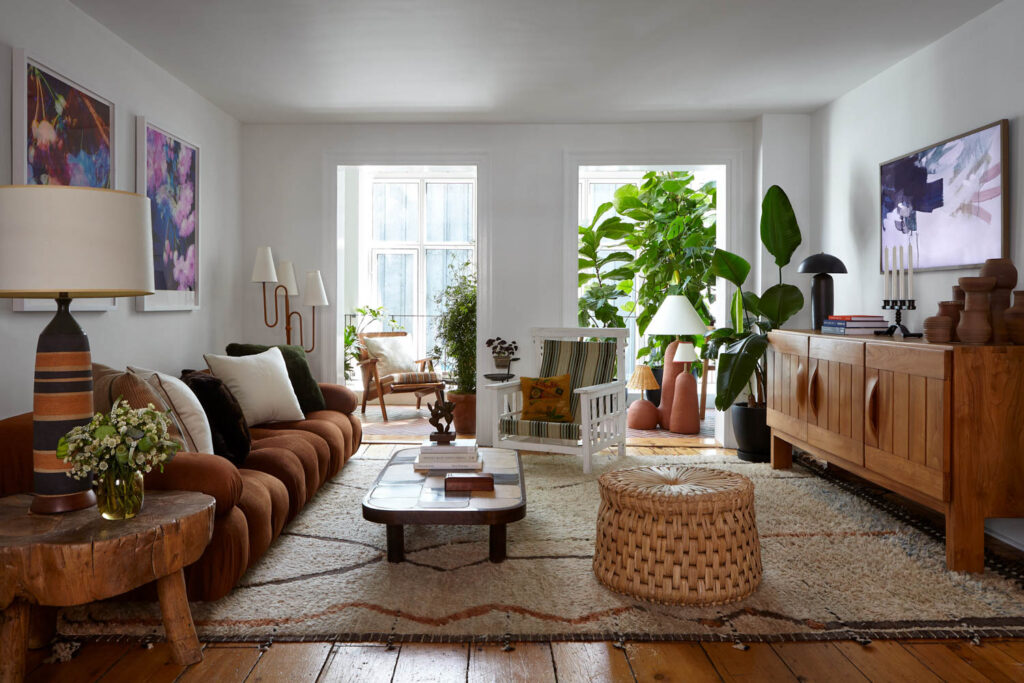 a living room with a view of a conservatory through the windows