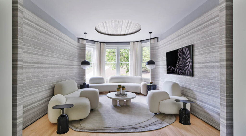 a white living room with plush furnishings