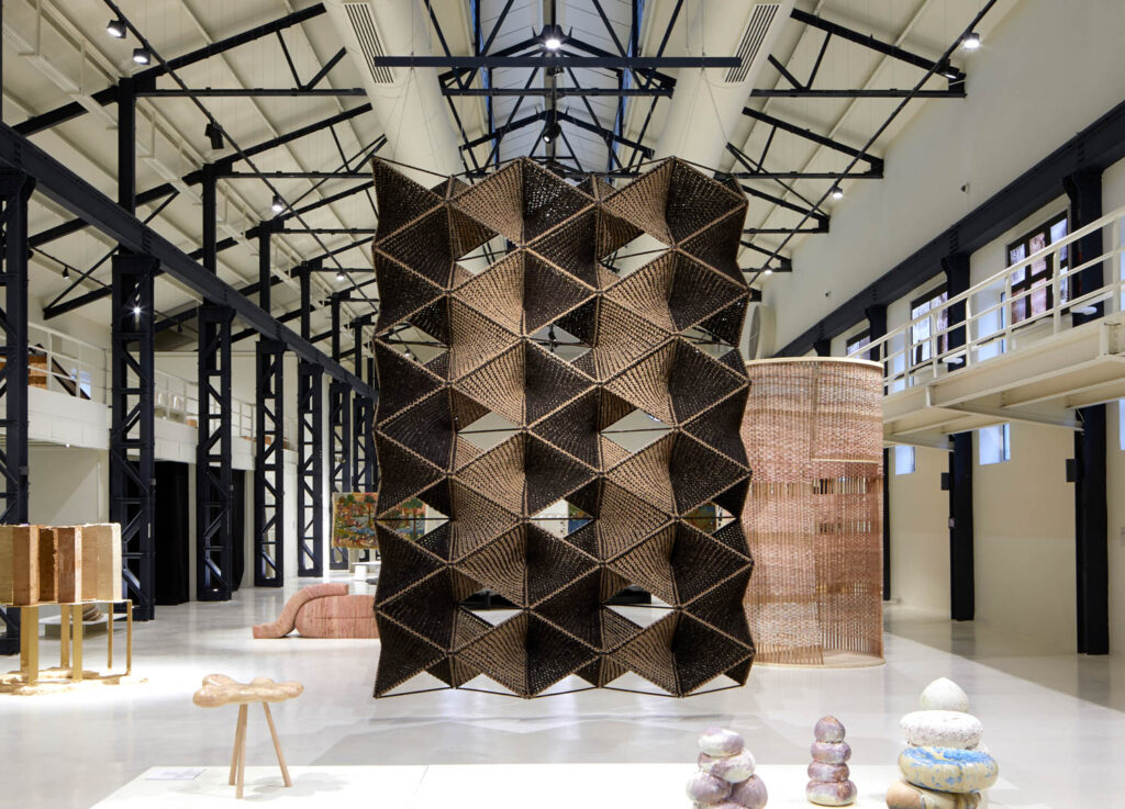 exhibition room with intricate brown patterns in textile