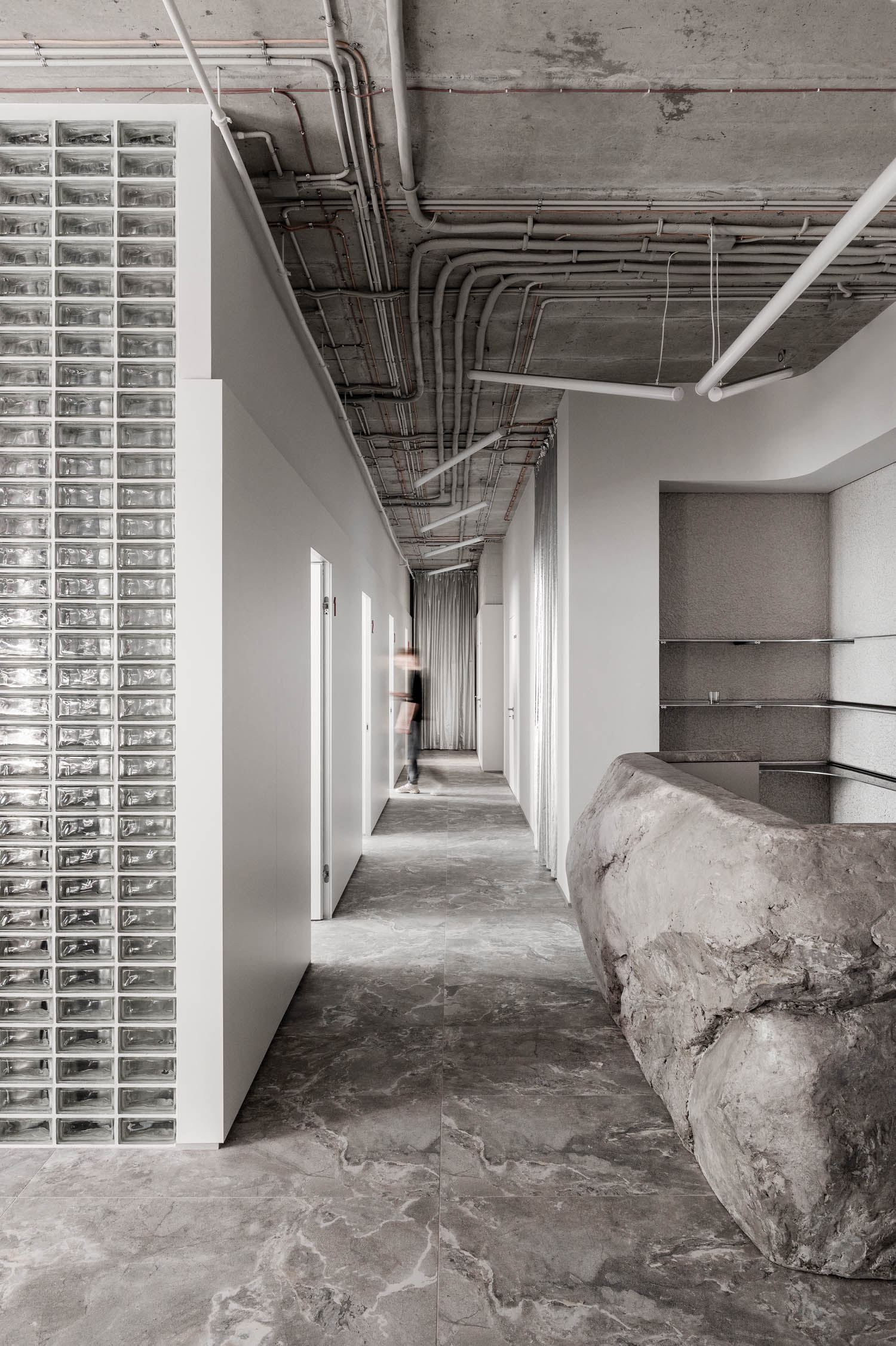 hallway with white walls and brutalist vibes