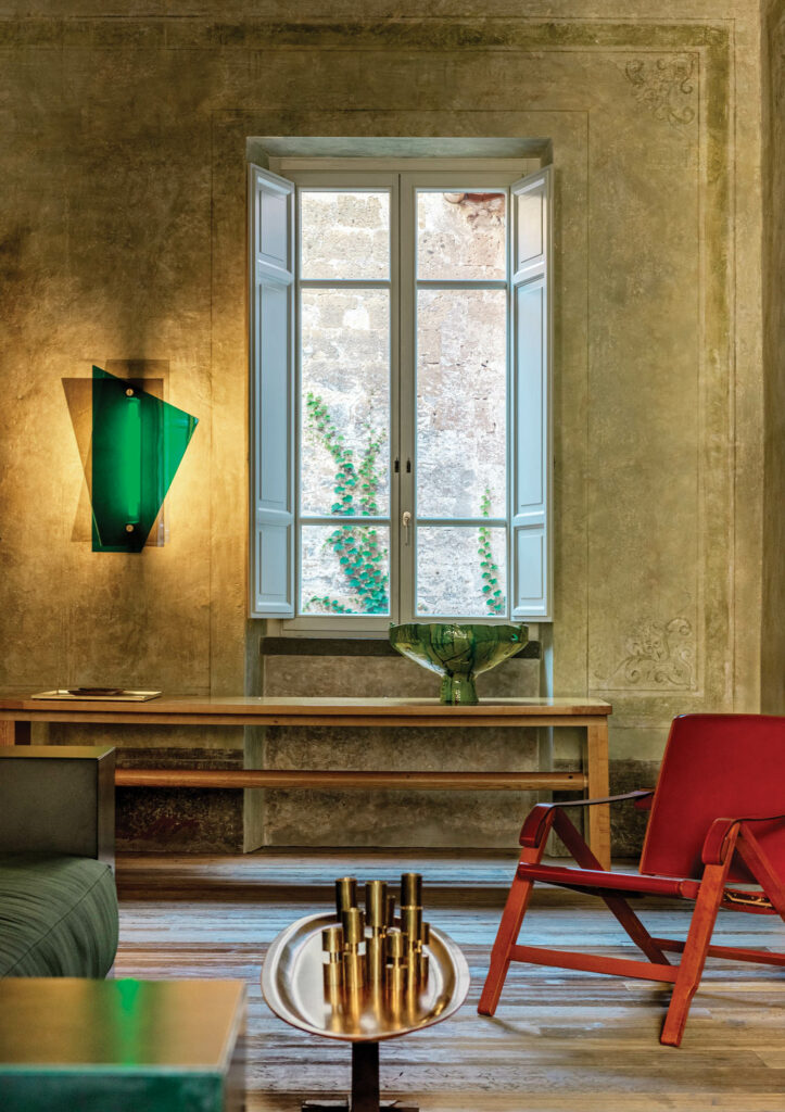 sitting space with red chair and wooden table