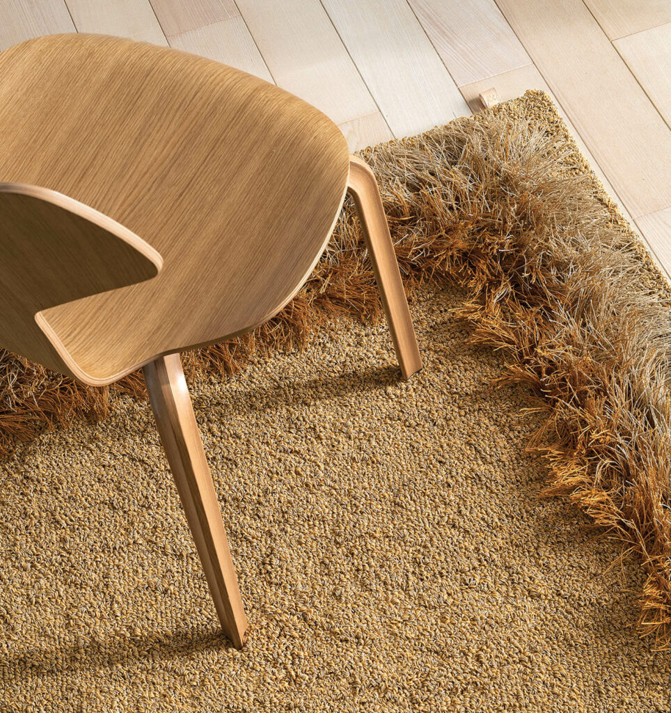 brown chair on top of brown grass rug