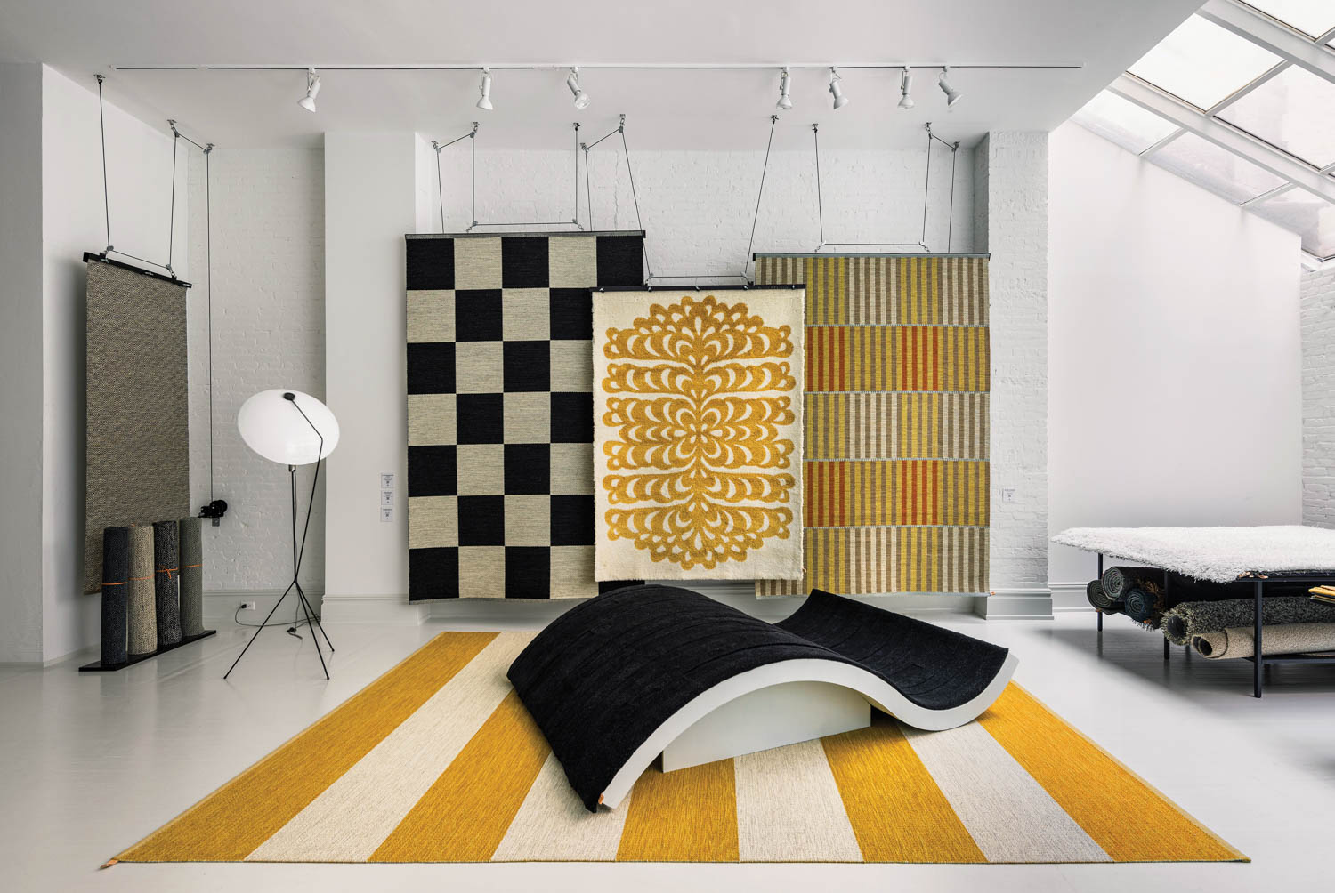 room with striped flooring, tapestries and curved chair