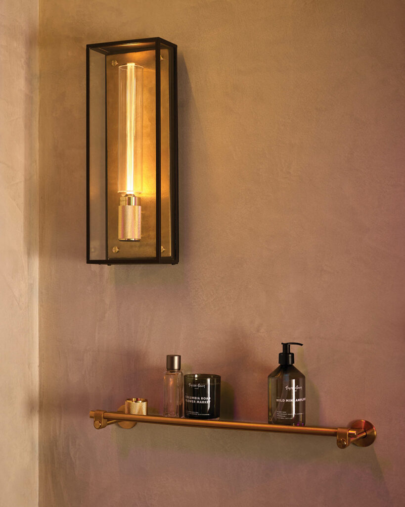 bronze wall sconce and towel rack